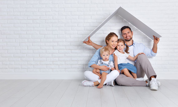 Family holding a roof over their heads