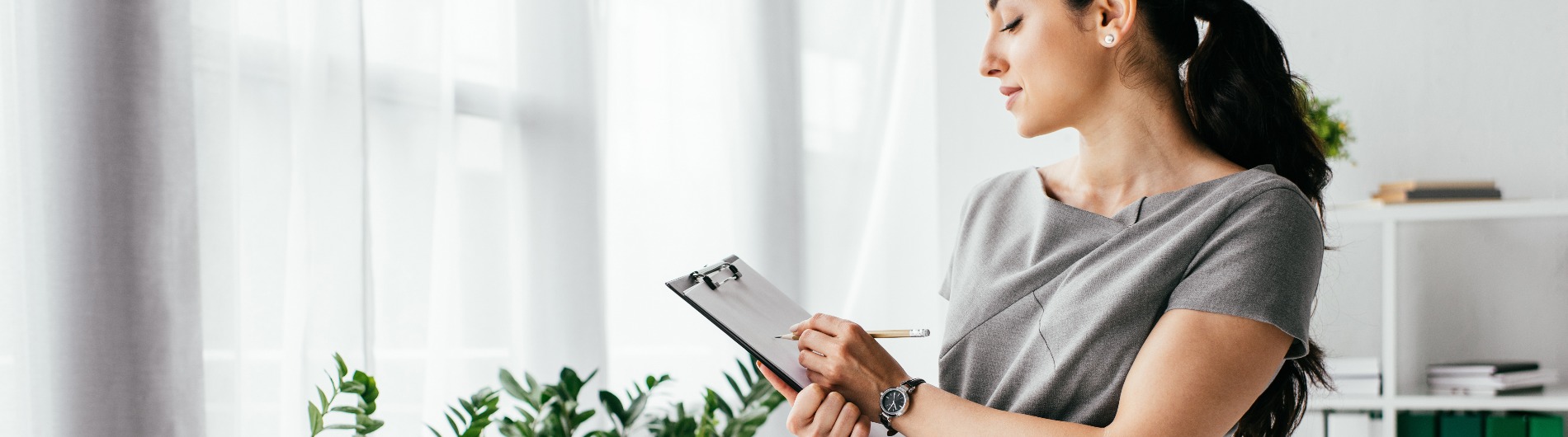 Lady holding clip board